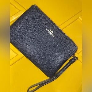 Coach navy blue corner zip wristlet 
4x6 with gold accents